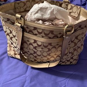 Gold and Tan with brown C’s on it .